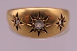 An Edwardian 18 ct gold diamond gypsy ring. Ring size P. 2.8 grammes total weight.