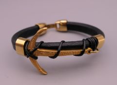 A Rolex leather and metal bracelet. 21 cm long.