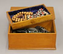 A box of costume jewellery.