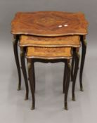 A nest of three modern marquetry inlaid tables. 61.5 cm wide.