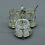 A silver condiment set, hallmarked for London 1882, makers mark Hukin & Heath. 8.5 cm long.