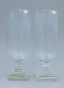 A pair of cut glass storm lamps. 40 cm high.