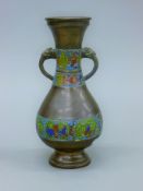 A Chinese bronze vase with enamel decoration, with seal mark to base. 27 cm high.