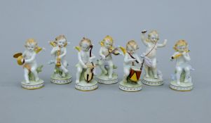 A Dresden porcelain music band. Each approximately 9 cm high.