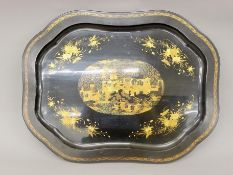 A 19th century chinoiserie lacquered tray. 64 cm wide.