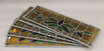 Five leaded stained glass panels. 76 x 26.5 cm.