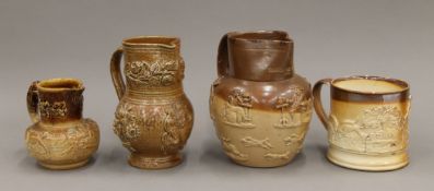 Three various 19th century stoneware jugs and a frog mug. The largest 16 cm high.