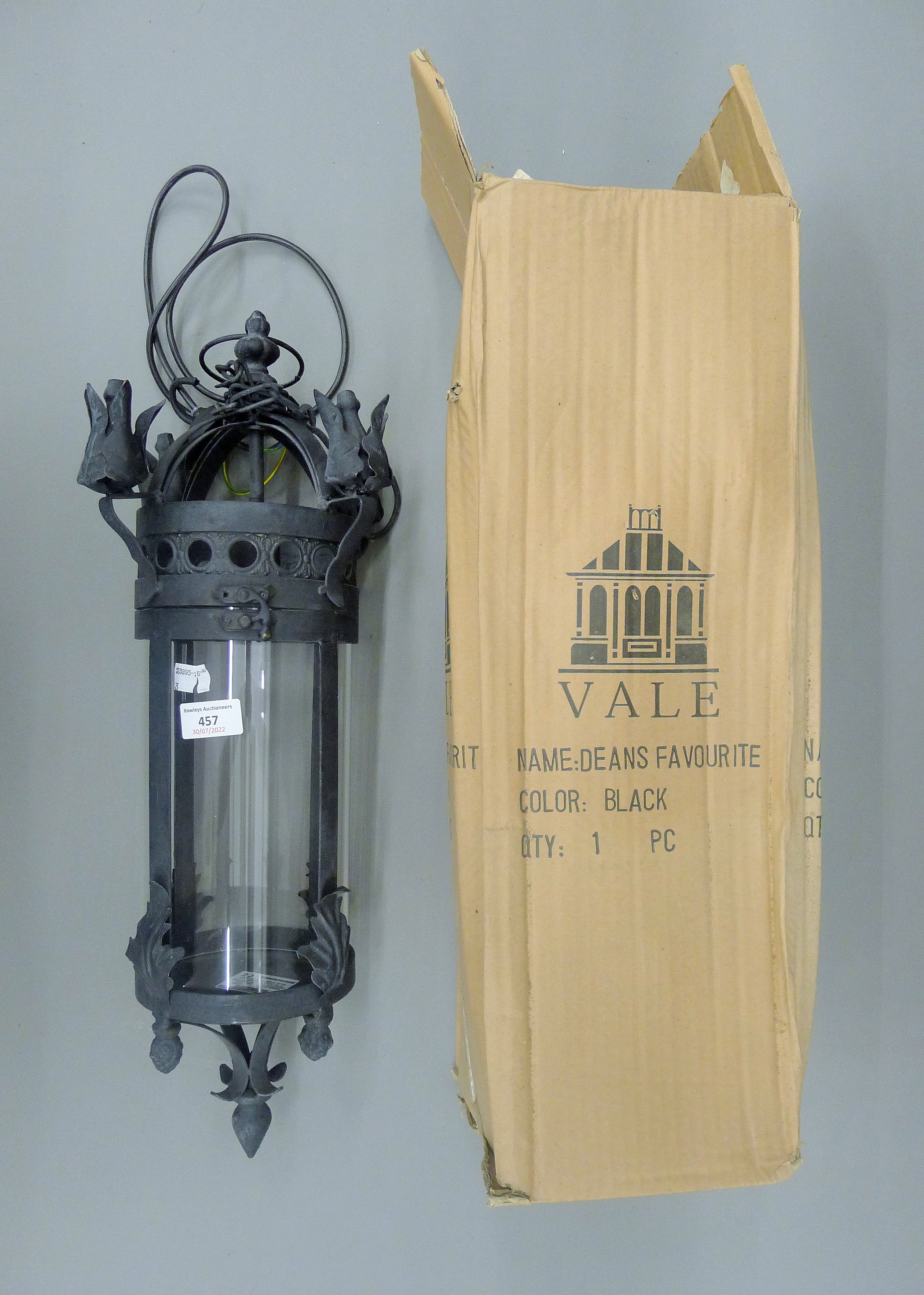 A pair of black hanging lanterns. 57 cm high.