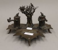 An unusual Trench Art desk stand. 21 cm wide.