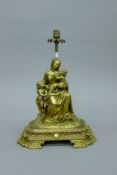 A gilt bronze lamp formed as a woman and children. 43 cm high.