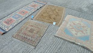 Four various rugs.