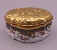 A 19th century 18 ct gold topped enamel box. 5.5 cm wide. 18.1 grammes of gold.