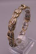 A 10 ct gold line bracelet, set with 5 carat approximate total carat weight of diamonds. 18.