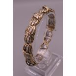 A 10 ct gold line bracelet, set with 5 carat approximate total carat weight of diamonds. 18.