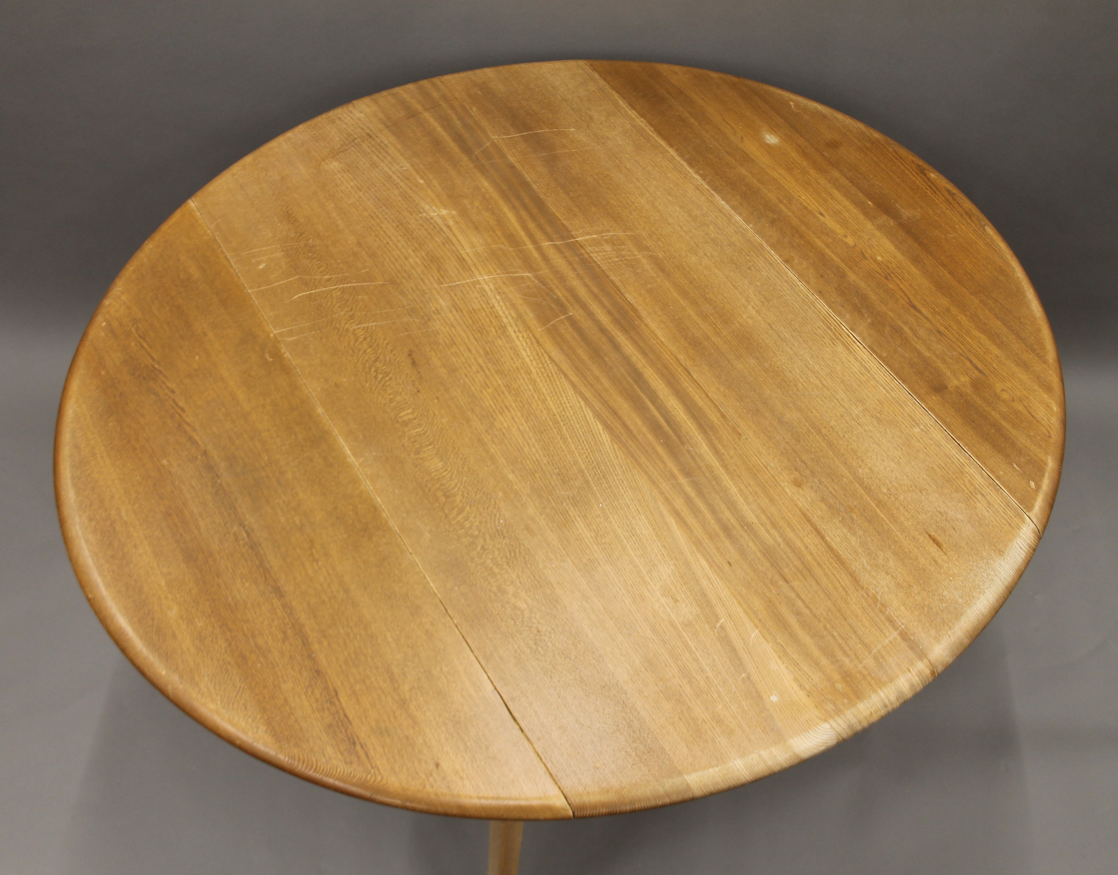 A blonde Ercol drop leaf table and two chairs. The table 112 cm long. - Image 5 of 8