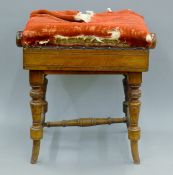 A Victorian walnut piano stool. 45 cm wide, 35 cm deep, maximum height 55 cm.