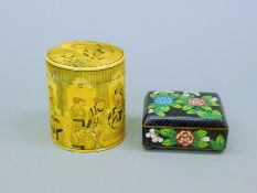 An early 20th century Canton cloisonne box and an Indian papier mache cylindrical box.