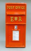 A red post box. 65 cm high.