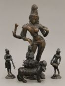 Four Indian bronze figures. The largest 23 cm high.