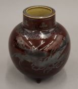 An Art pottery vase decorated with a dragon. 14.5 cm high.