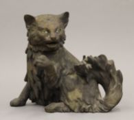 A 19th century French bronze automaton clock mount formed as a cat. 14 cm high.