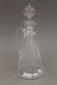 A Victorian etched glass ewer. 28.5 cm high.