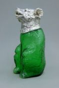 A silver plated mounted glass claret jug formed as a bear. 22 cm high.