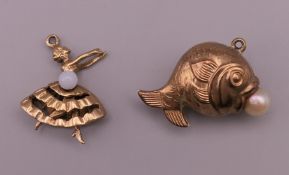 Two 9 ct gold charms comprising of a fish with a pearl and an articulated ballerina. The largest 2.
