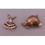 Two 9 ct gold charms comprising of a fish with a pearl and an articulated ballerina. The largest 2.