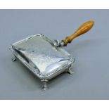 A silver silent butler. 10 cm wide. 133.4 grammes total weight.