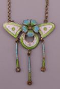 An Art Nouveau chrome plate enamel floral drop pendant necklace. Pendant 4.5 cm high.