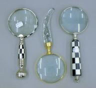 Three magnifying glasses.