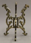An 18th century bronze folding stand. 21 cm high.