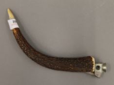 An antler handled cigar cutter. 24 cm long.