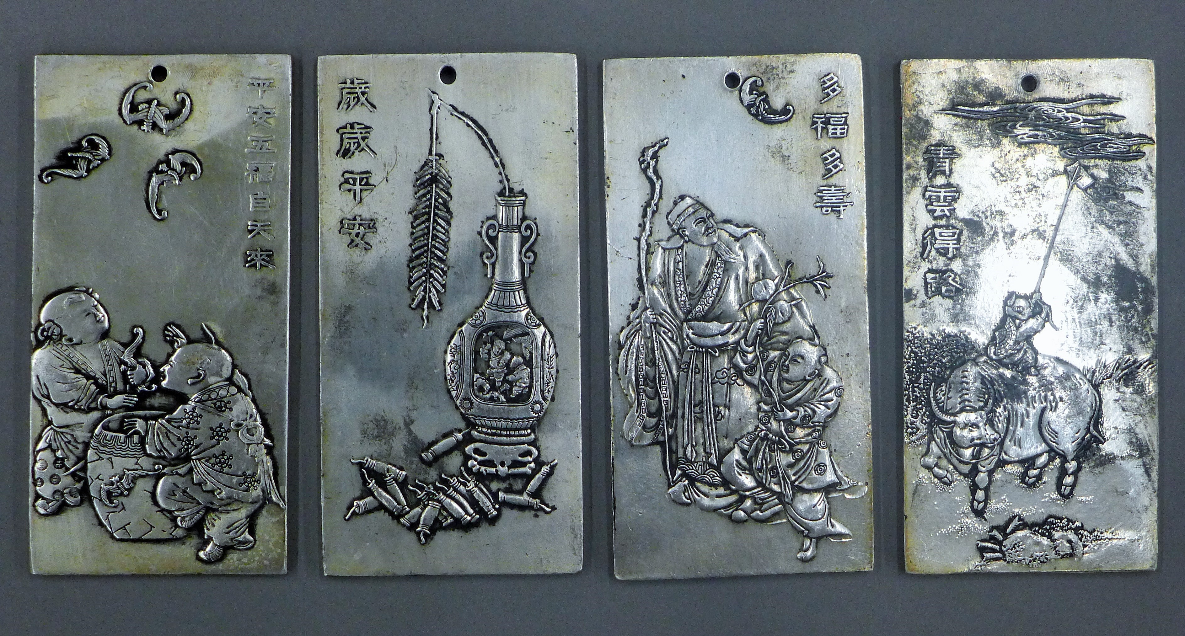 Four Chinese ingots.
