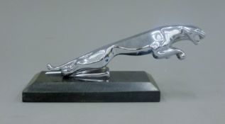 A leaping jaguar desk weight. 20.5 cm long.