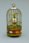 A cloisonne birdcage clock. 16.5 cm high.