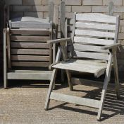 A set of four wooden garden chairs.
