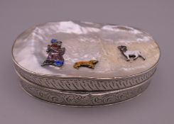 A enamel decorated mother-of-pearl set Continental silver box. 9 cm wide.