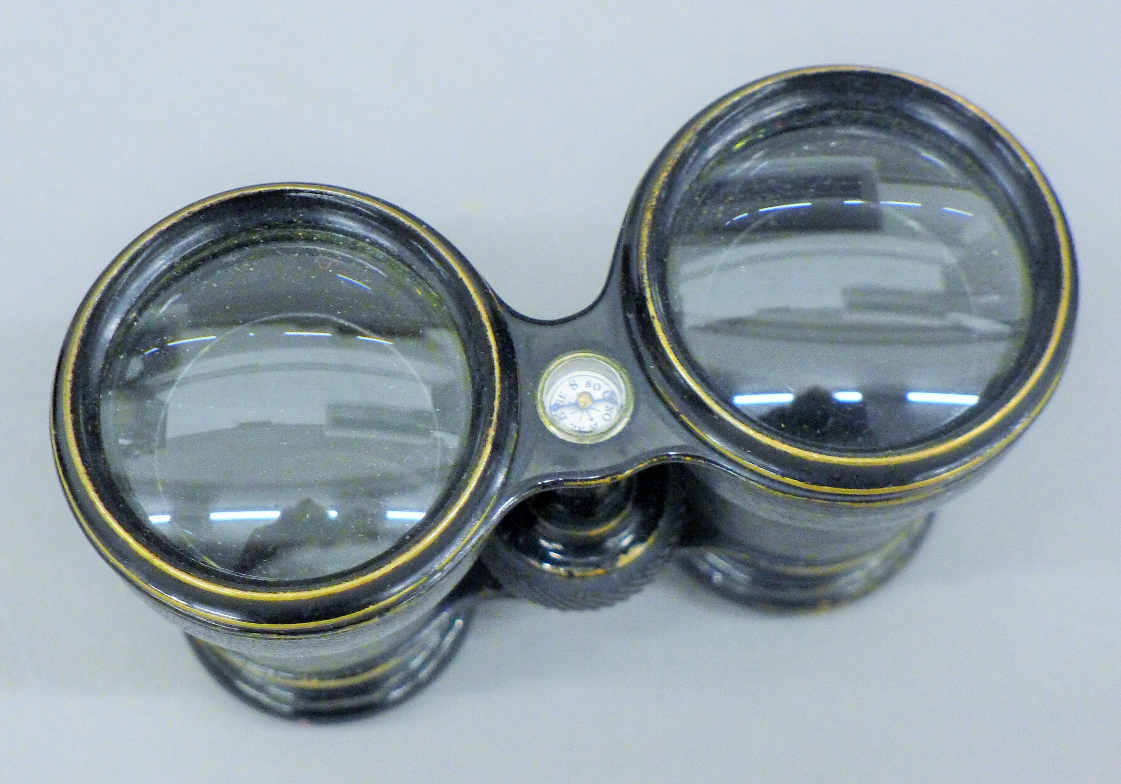 A pair of field glasses with inset compass, case. 13.5 cm wide overall. - Image 3 of 5