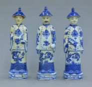 A set of three Chinese porcelain blue and white men. 27 cm high.