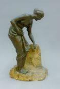A 19th century bronze model of a girl at a fountain. 38.5 cm high.