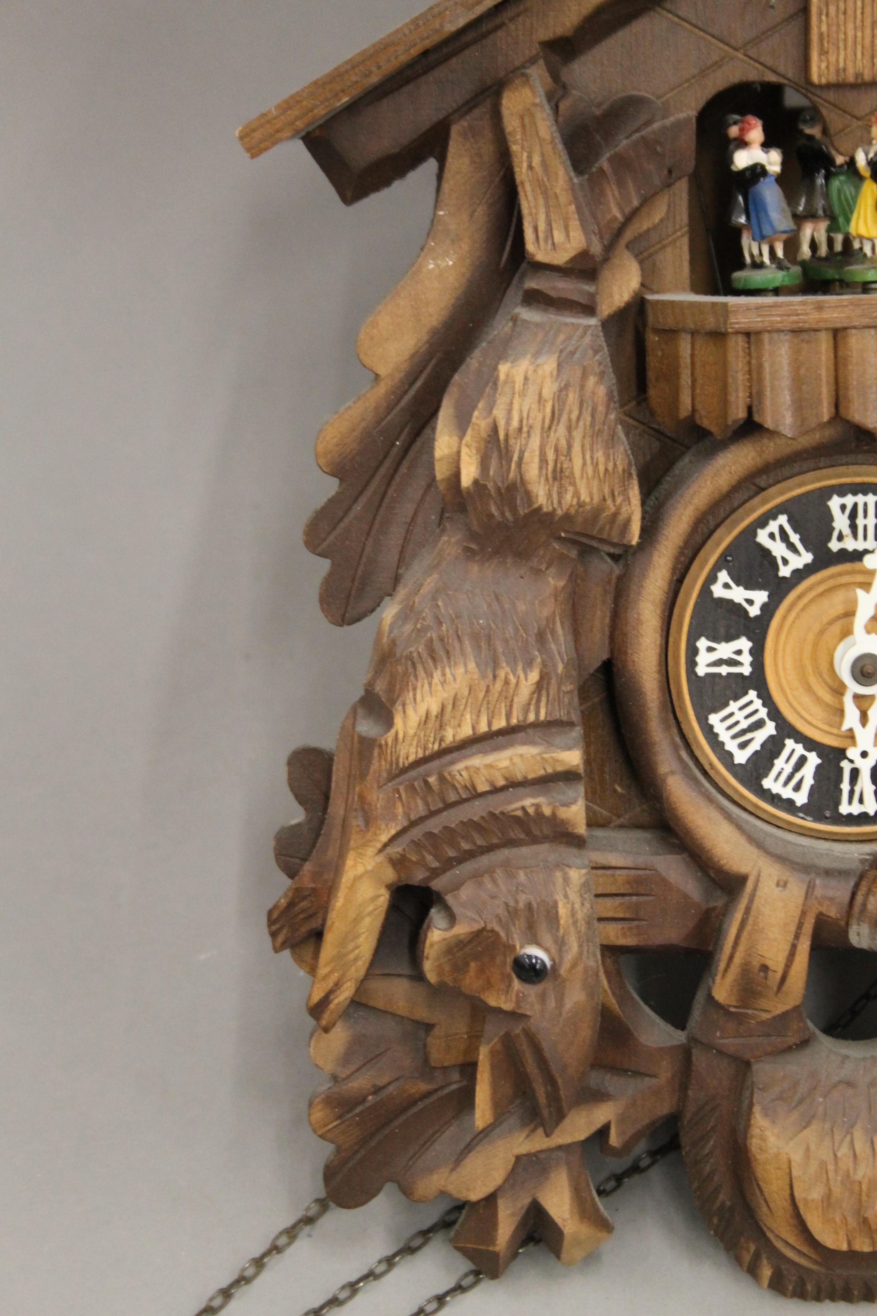 A Blackforest cuckoo clock with roundabout. Approximately 49 cm high. - Image 5 of 9