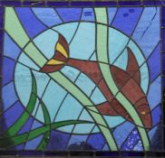 A stained leaded glass panel centred with a fish. 80 x 74.5 cm.