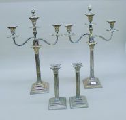 A pair of silver plated three-branch candelabra with Corinthian column stems (each 65 cm high),