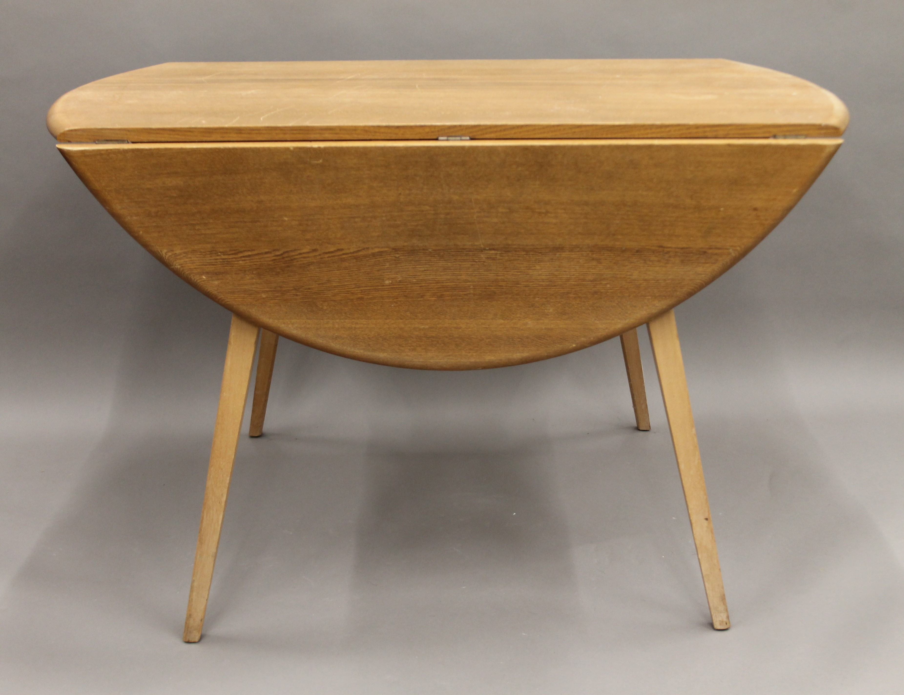 A blonde Ercol drop leaf table and two chairs. The table 112 cm long. - Image 3 of 8