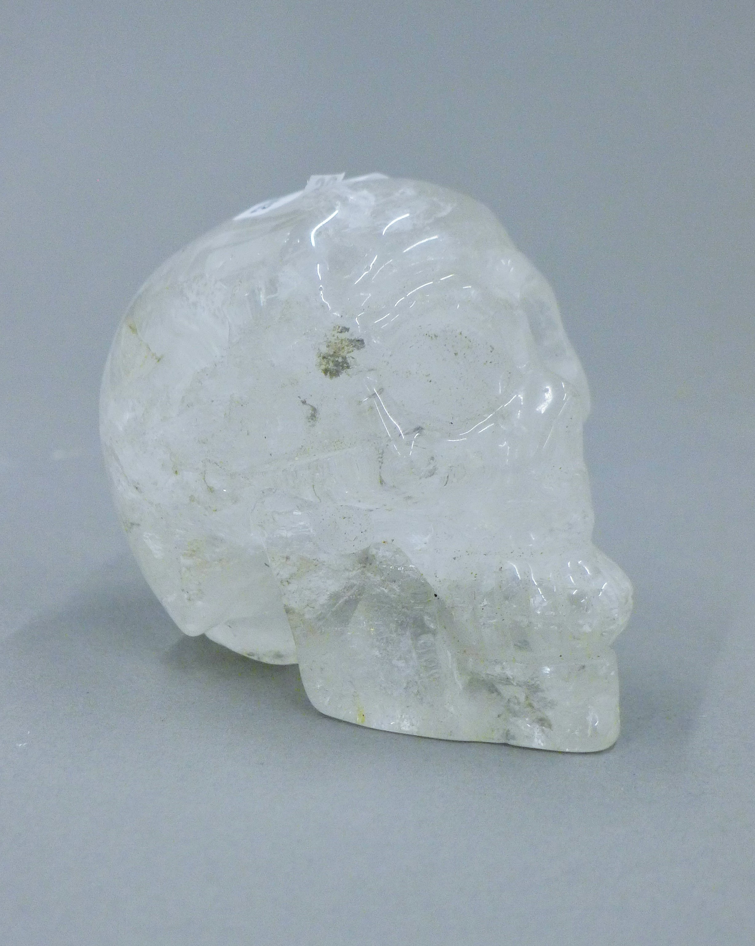 A rock crystal skull. 7.5 cm high.
