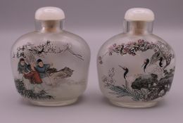 Two reverse painted snuff bottles. Each approximately 6.5 cm high.