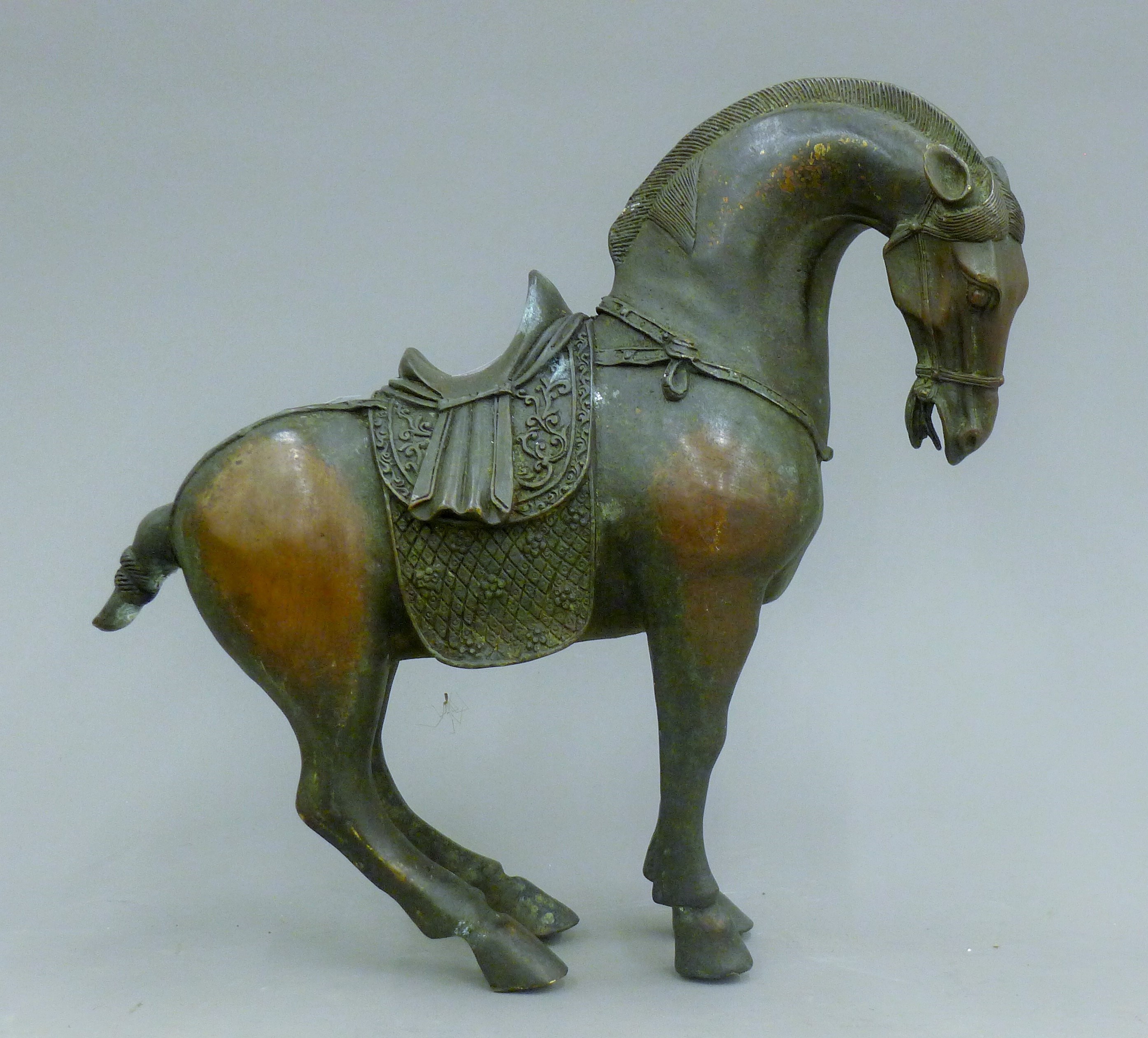 A Chinese bronze model of a horse. 26 cm high.