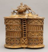 A late 19th century Blackforest carved wooden sewing box. 32 cm high.